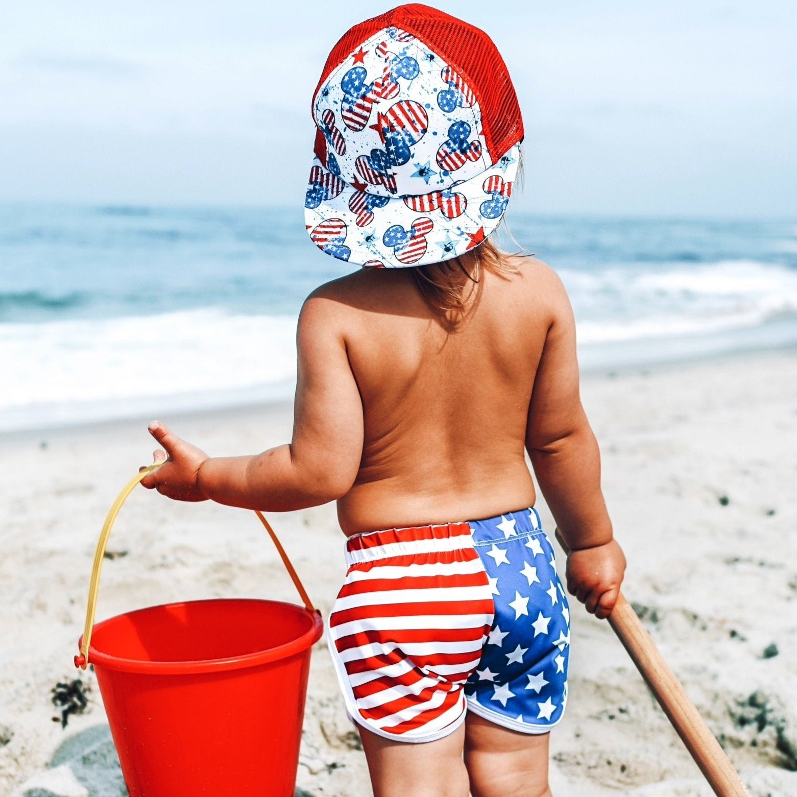 An image of a child in the Stars and Stripes Track Shorts.