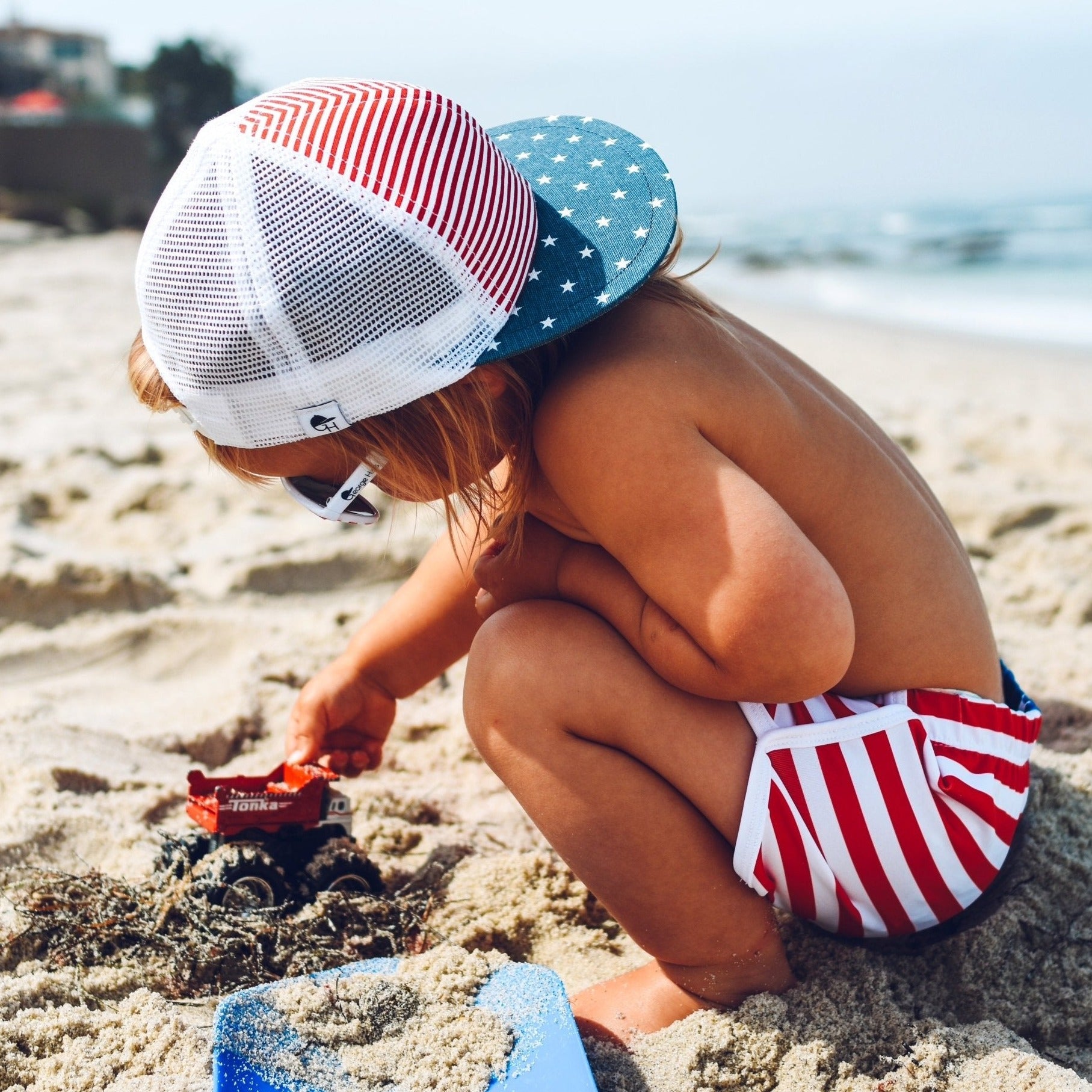 An image of a child in the Stars and Stripes Track Shorts.