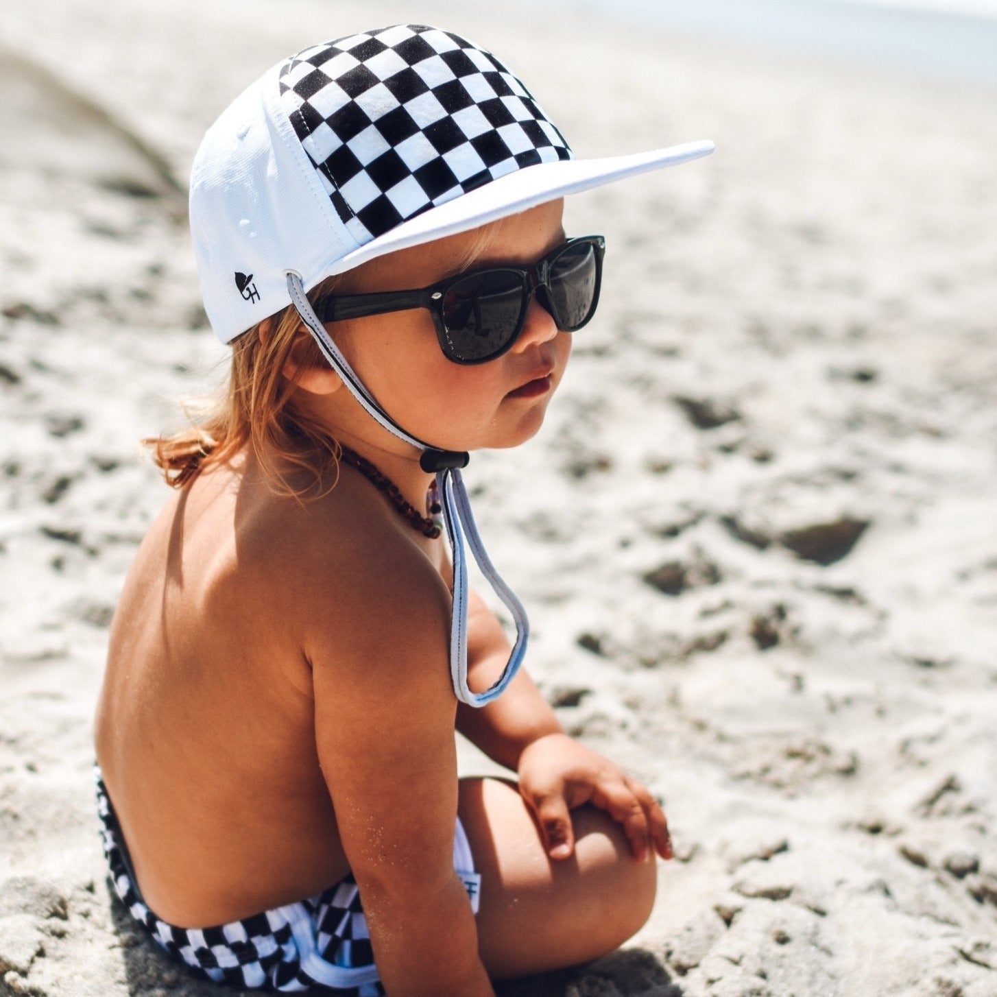 An image of a child in the Check Surf Hat.