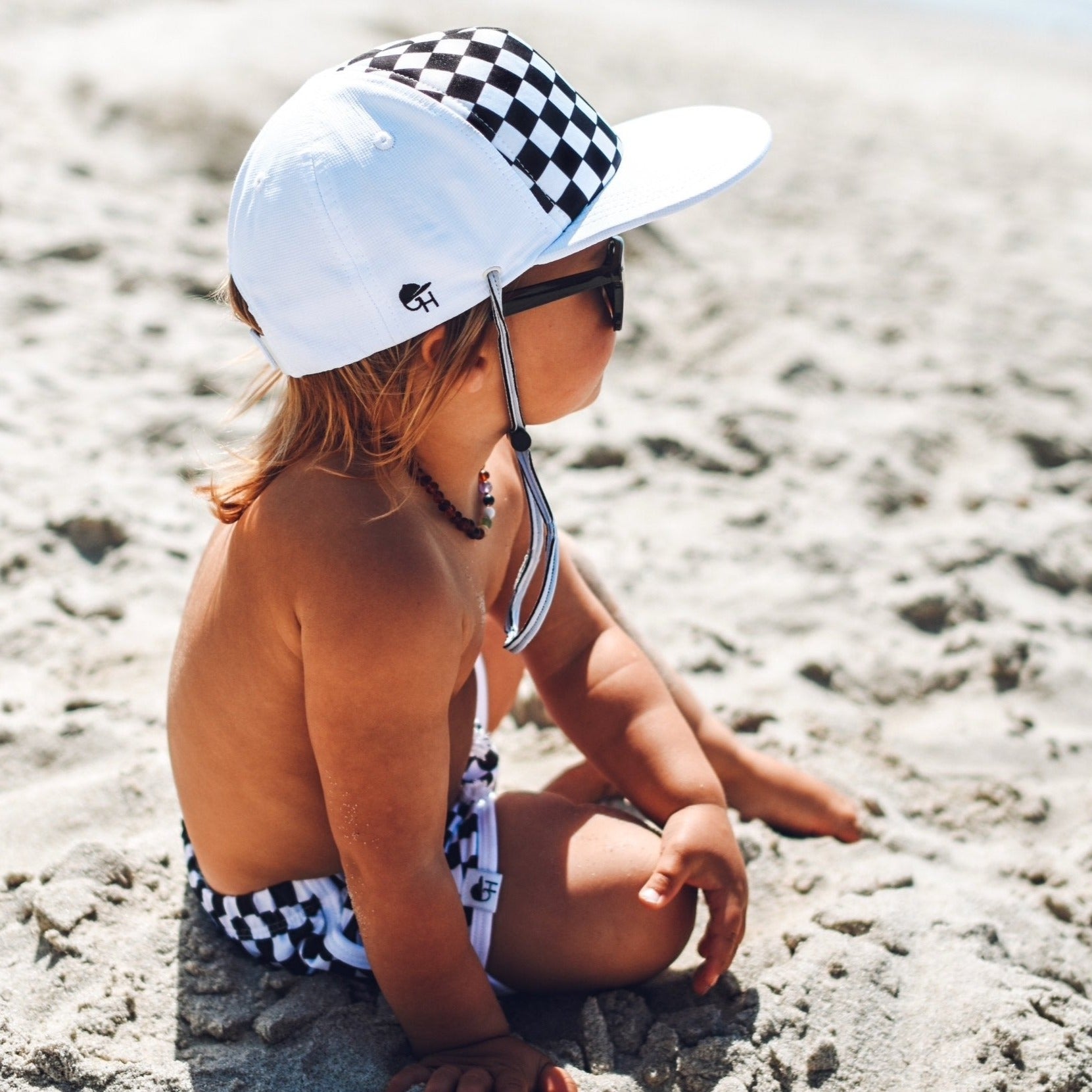 An image of a child in the Check Surf Hat.