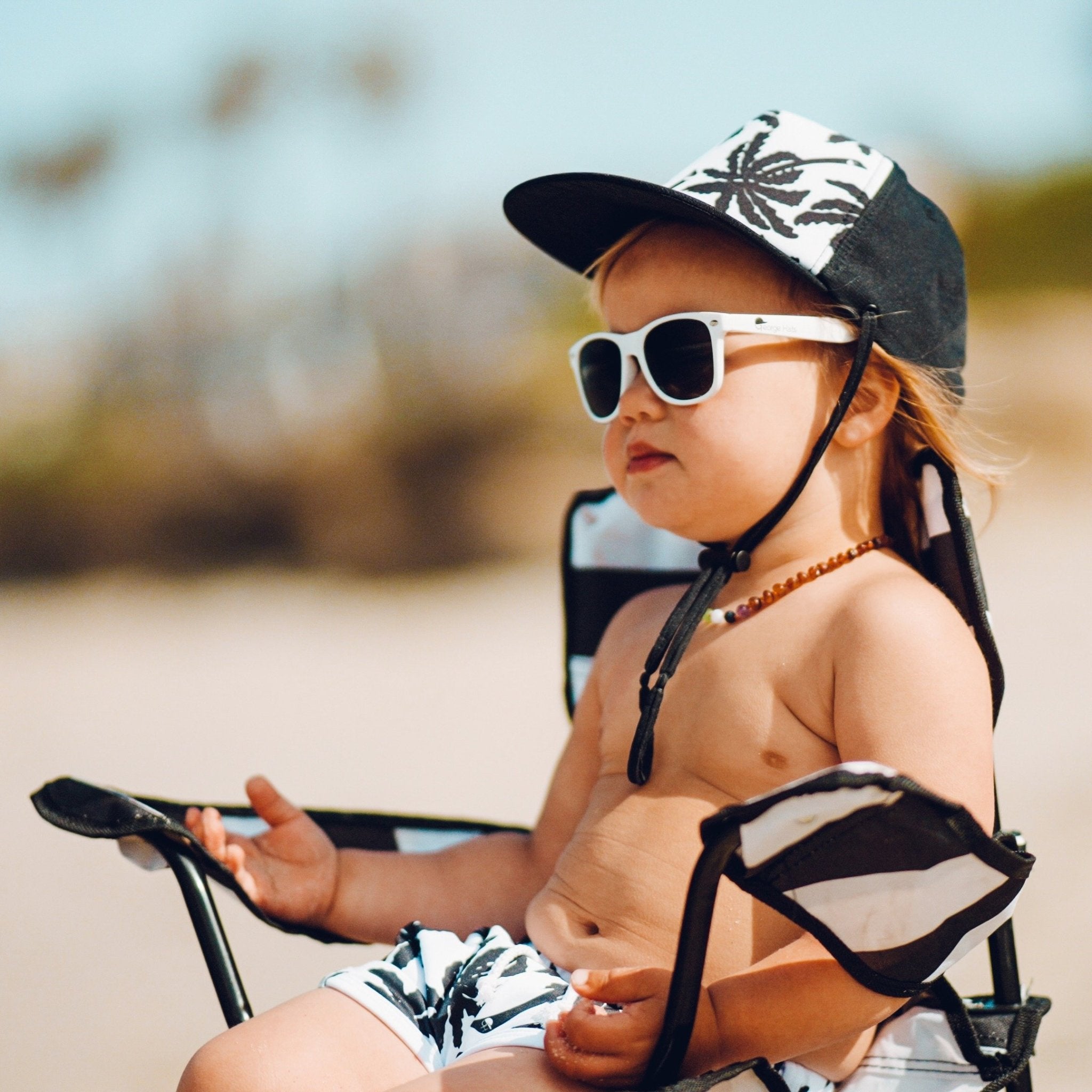 An image of a child in the BW Palm Hat from George Hats.