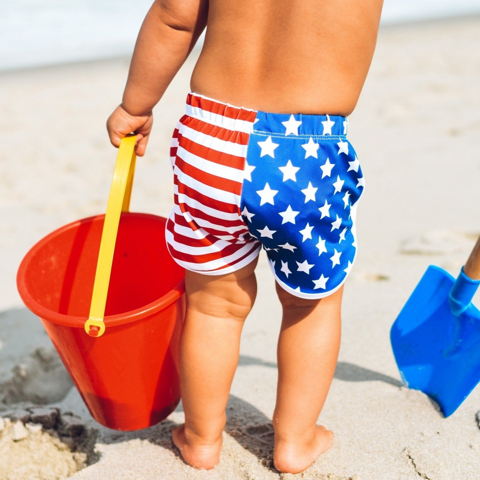 An image of a child in the Stars and Stripes Track Shorts.